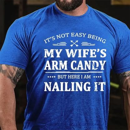 It's Not Easy Being My Wife's Arm Candy But Here I Am Nailing It  T-Shirt