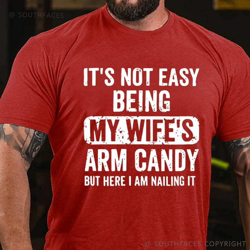 It's Not Easy Being My Wife's Arm Candy But Here I Am Nailing It T-Shirt