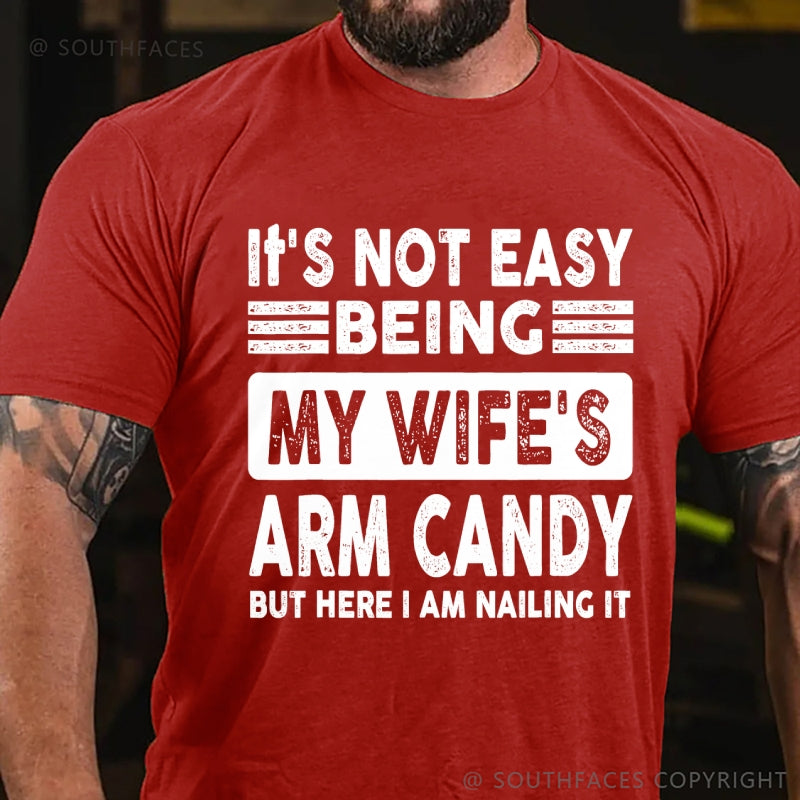 It's Not Easy Being My Wife's Arm Candy But Here I Am Nailing It T-Shirt