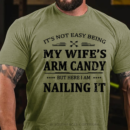 It's Not Easy Being My Wife's Arm Candy But Here I Am Nailing It  T-Shirt
