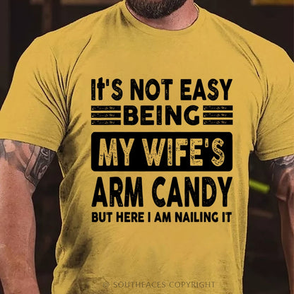 It's Not Easy Being My Wife's Arm Candy But Here I Am Nailing It T-Shirt