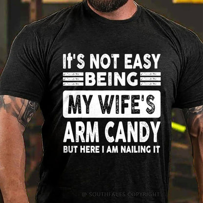It's Not Easy Being My Wife's Arm Candy But Here I Am Nailing It T-Shirt