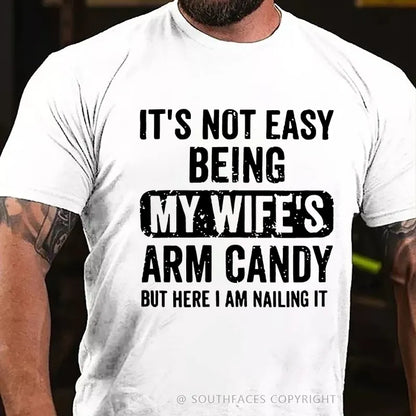 It's Not Easy Being My Wife's Arm Candy But Here I Am Nailing It T-Shirt