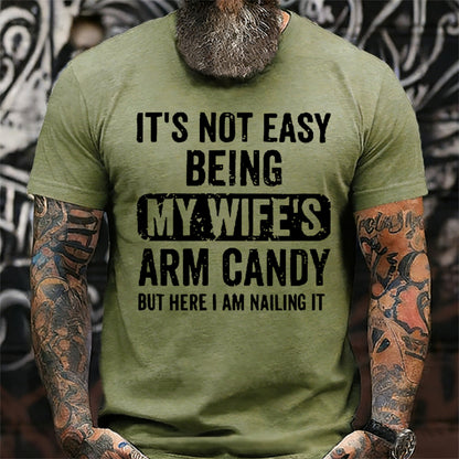 It's Not Easy Being My Wife's Arm Candy But Here I Am Nailing It T-Shirt