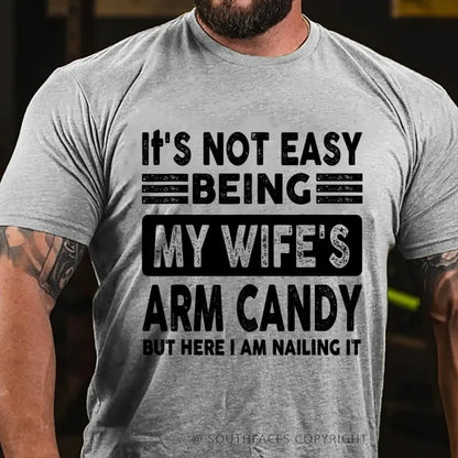 It's Not Easy Being My Wife's Arm Candy But Here I Am Nailing It T-Shirt
