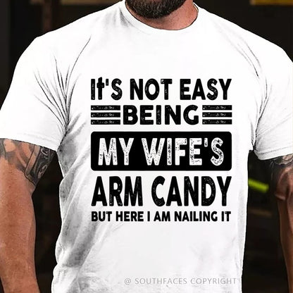 It's Not Easy Being My Wife's Arm Candy But Here I Am Nailing It T-Shirt
