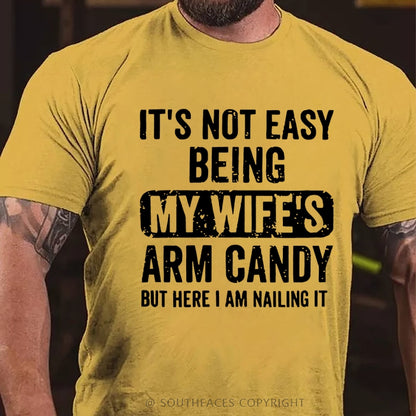It's Not Easy Being My Wife's Arm Candy But Here I Am Nailing It T-Shirt